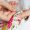 Woman hands doing cross-stitch. A close up of  embroidery.